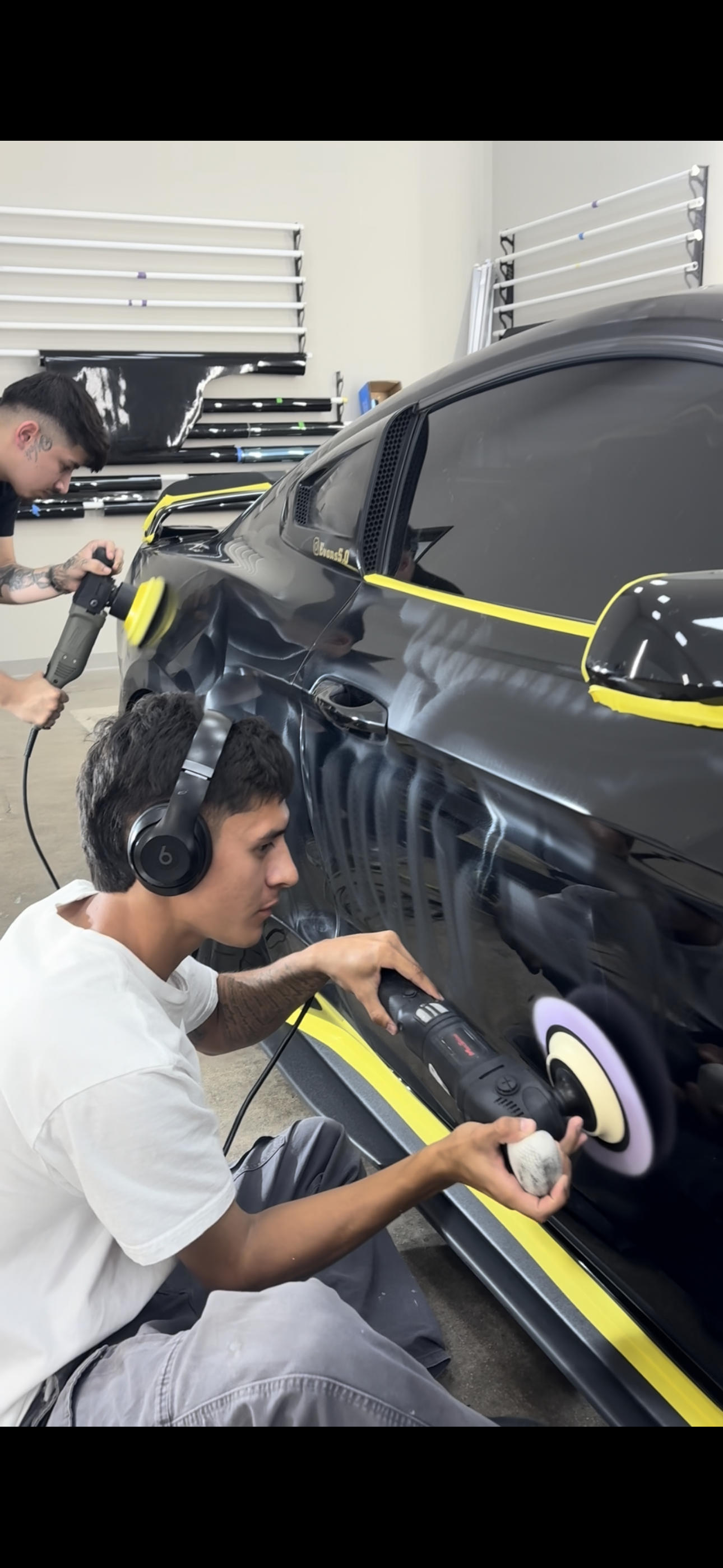 Professional paint correction machine polishing on vehicle